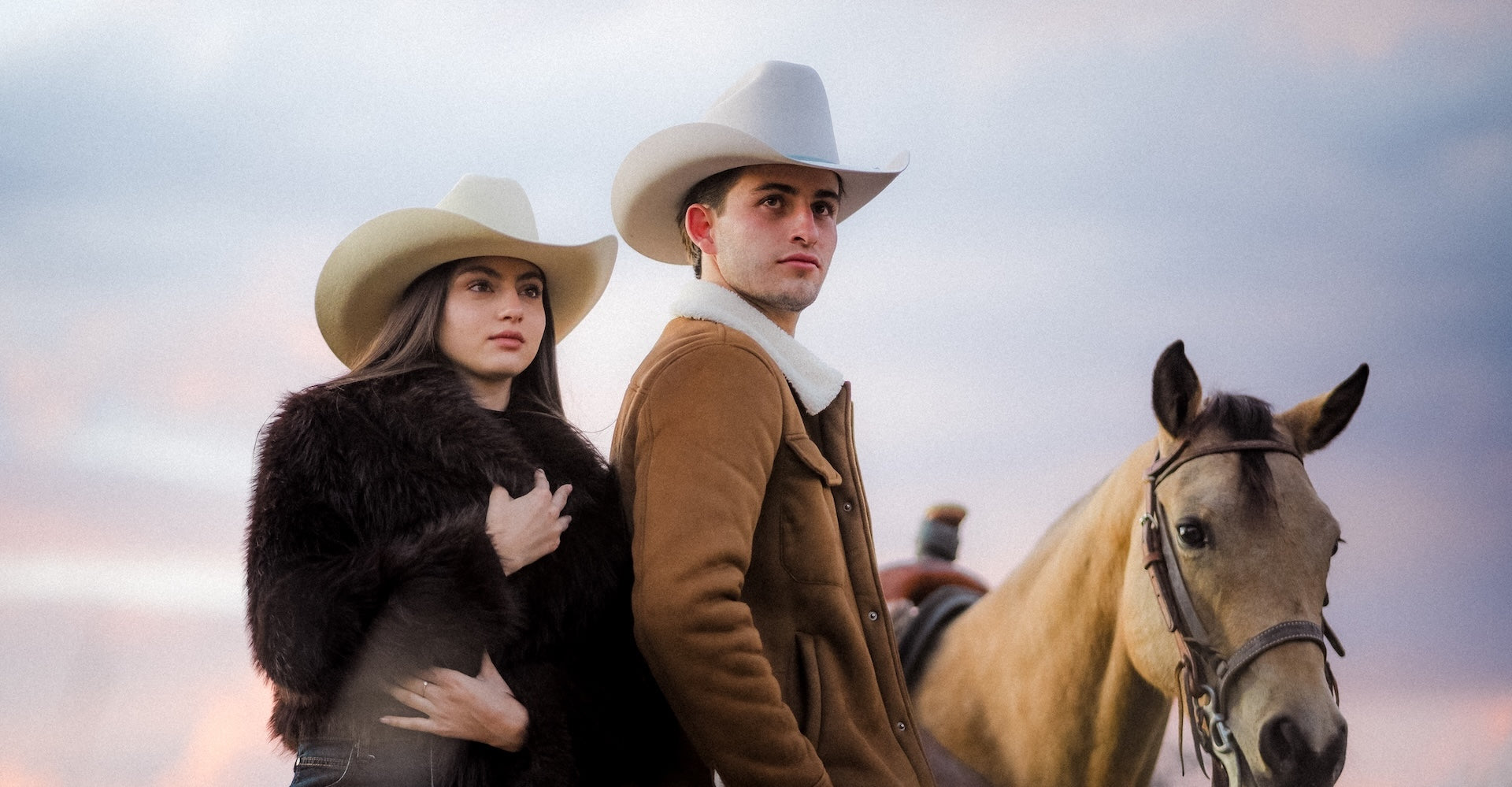 Group of people wearing cowboy boots and denim jeans