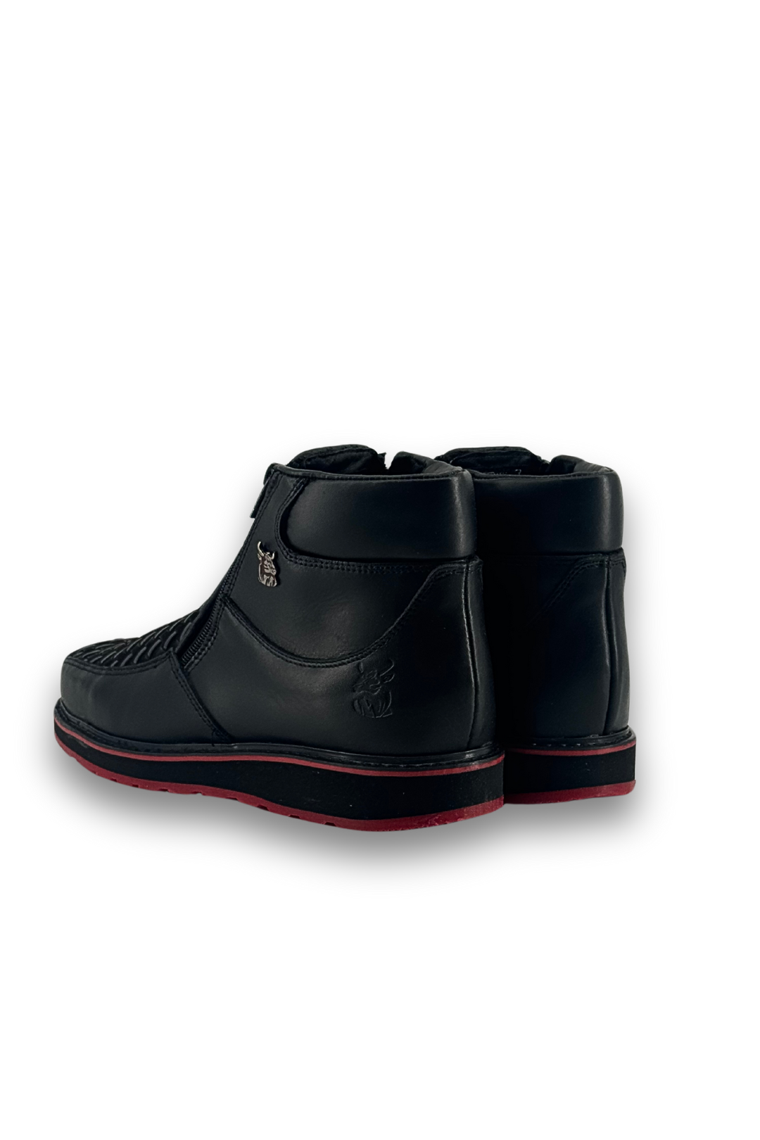 Back view of the onyx red bottom are leather botines, featuring a square toe, woven-textured panel across the vamp, and rubber heel.