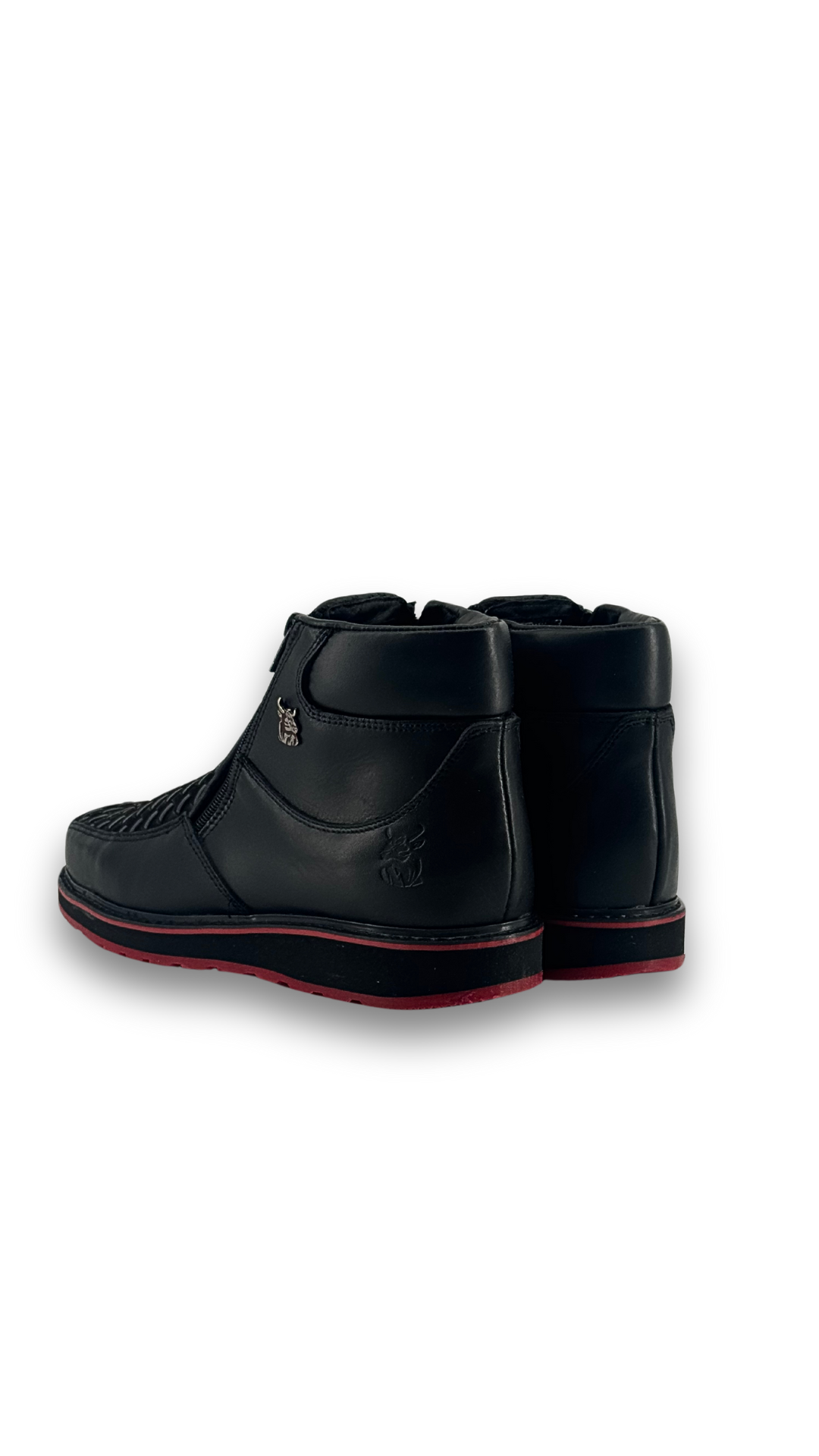 Back view of the onyx red bottom are leather botines, featuring a square toe, woven-textured panel across the vamp, and rubber heel.