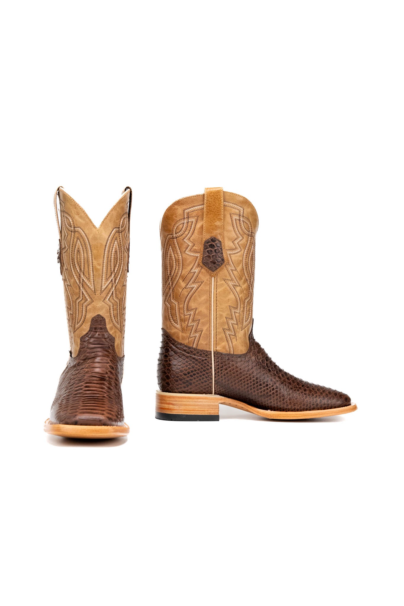 Side view of the renegate python cowboy boot in brown showcasing the python print vamp, flame embroidery, tan shaft and leather stacked heels.