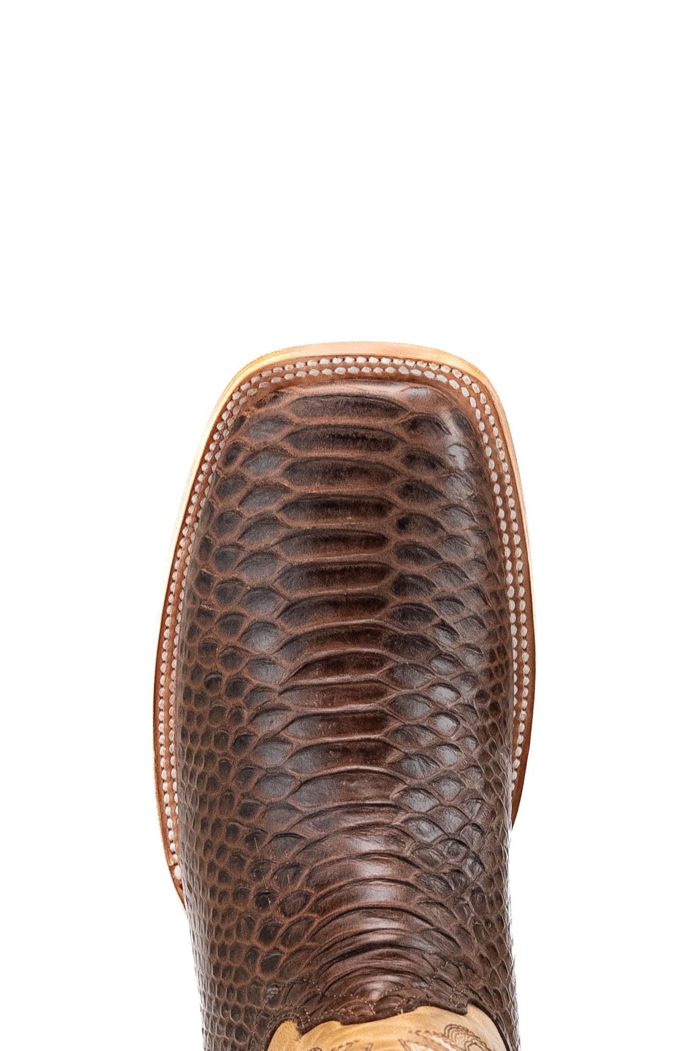 Top-down close-up of renegate python cowboy boot vamp in brown, showcasing the python print detail, double stitching and square toe. 