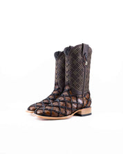 The Bradley boot features a honey Pirarucu fish print vamp, a brown leather shaft with a laser-cut pattern, a square toe, and a natural-tone sole.