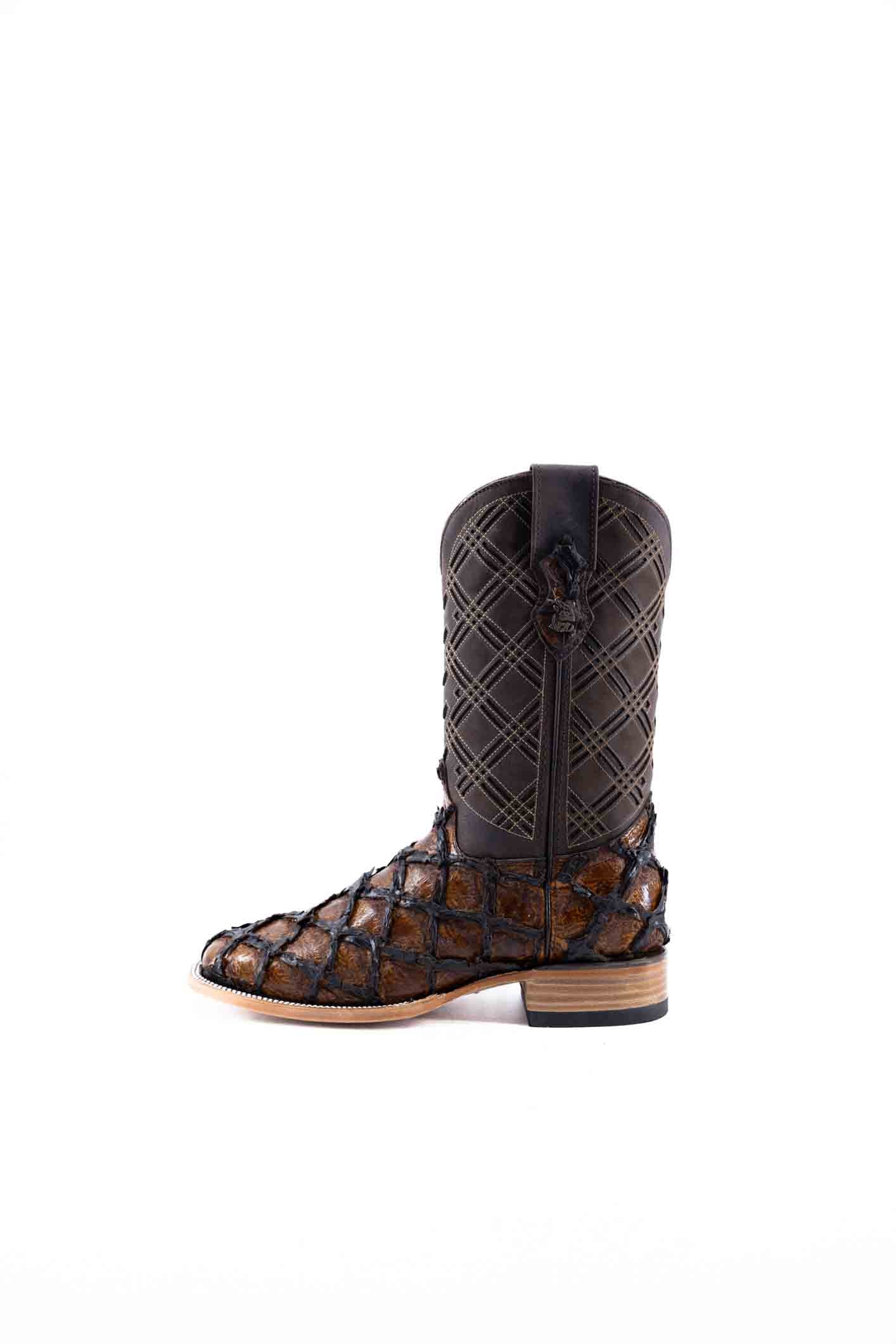 The Bradley boot features a honey Pirarucu fish print vamp, a brown leather shaft with a laser-cut pattern, a square toe, and a natural-tone sole.