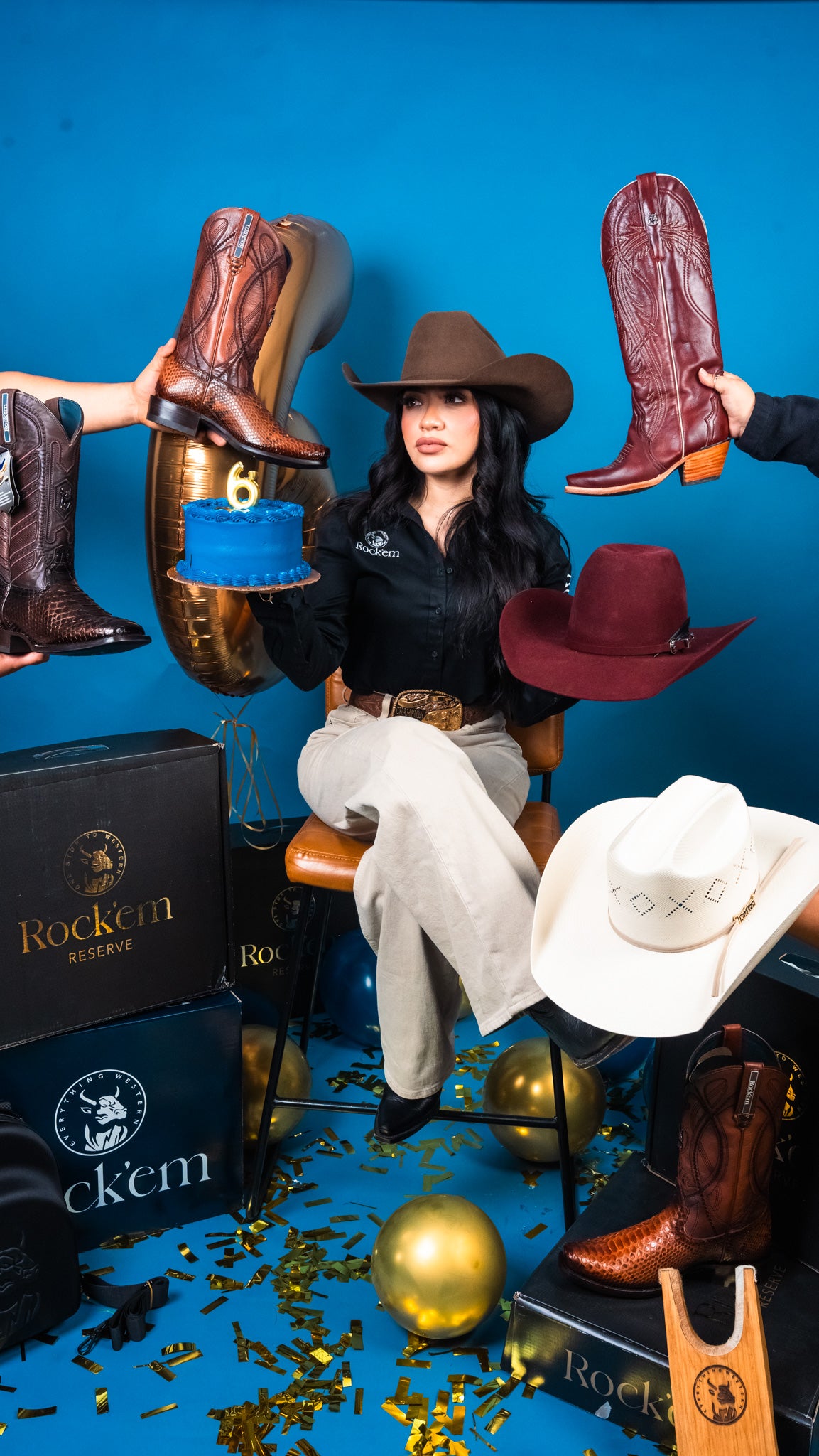 Woman in cowboy hat surrounded by cowboy boots and hats on a blue background