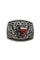 Close up view of a silver metal belt buckle with scrollwork and the Texas state emblem in the middle.