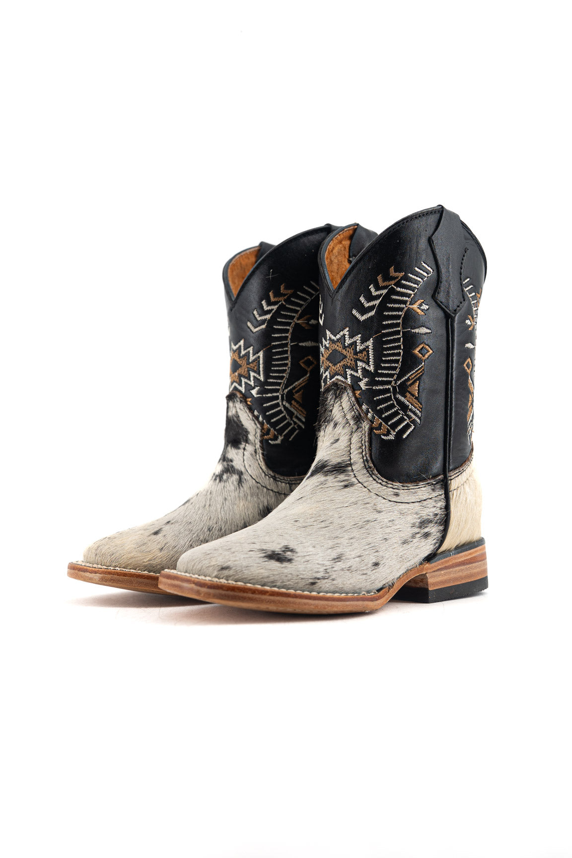 Pair of cowboy boots with intricate designs on a white background