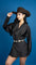 Close-up view of a woman wearing a  a long-sleeved, black satin blouson mini dress with a draped cowl neck.