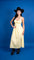 Full body photo of a woman wearing a yellow maxi dress.