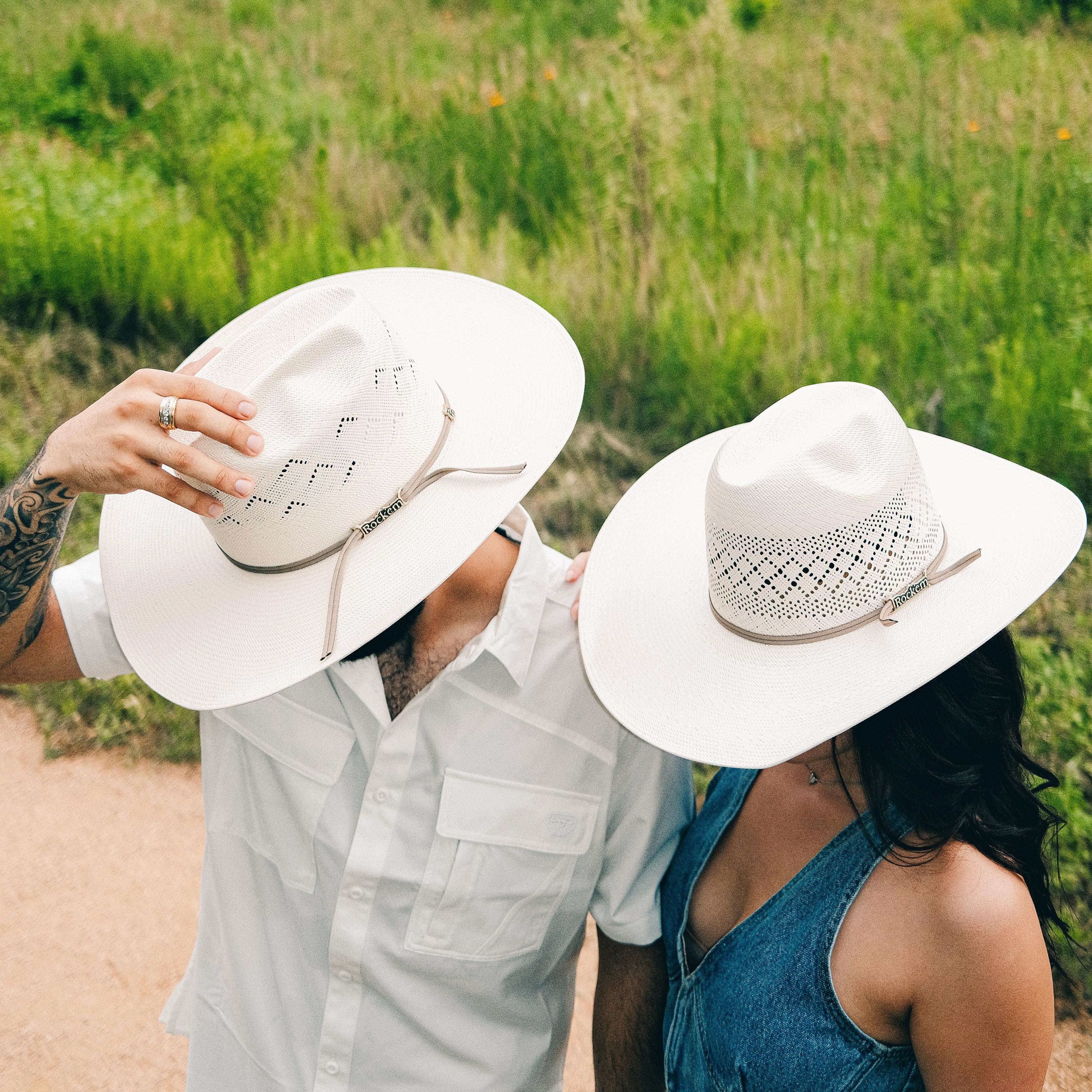 Two People side by side wearing Rock'em Straw Hats