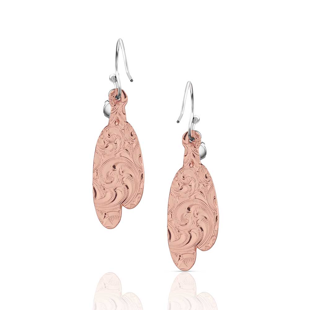 Rose gold earrings with intricate designs on a white background