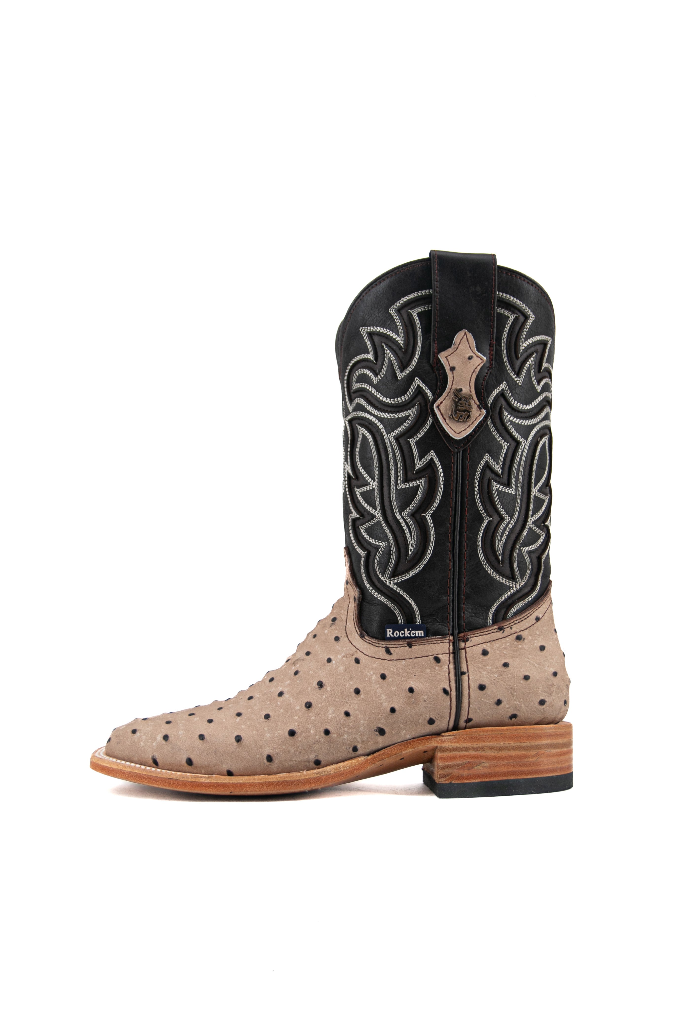 Side view of the Bruce ostrich cowboy boot in Desert showcasing the ostrich vamp, white flame inlays, dark shaft and leather stacked heels.