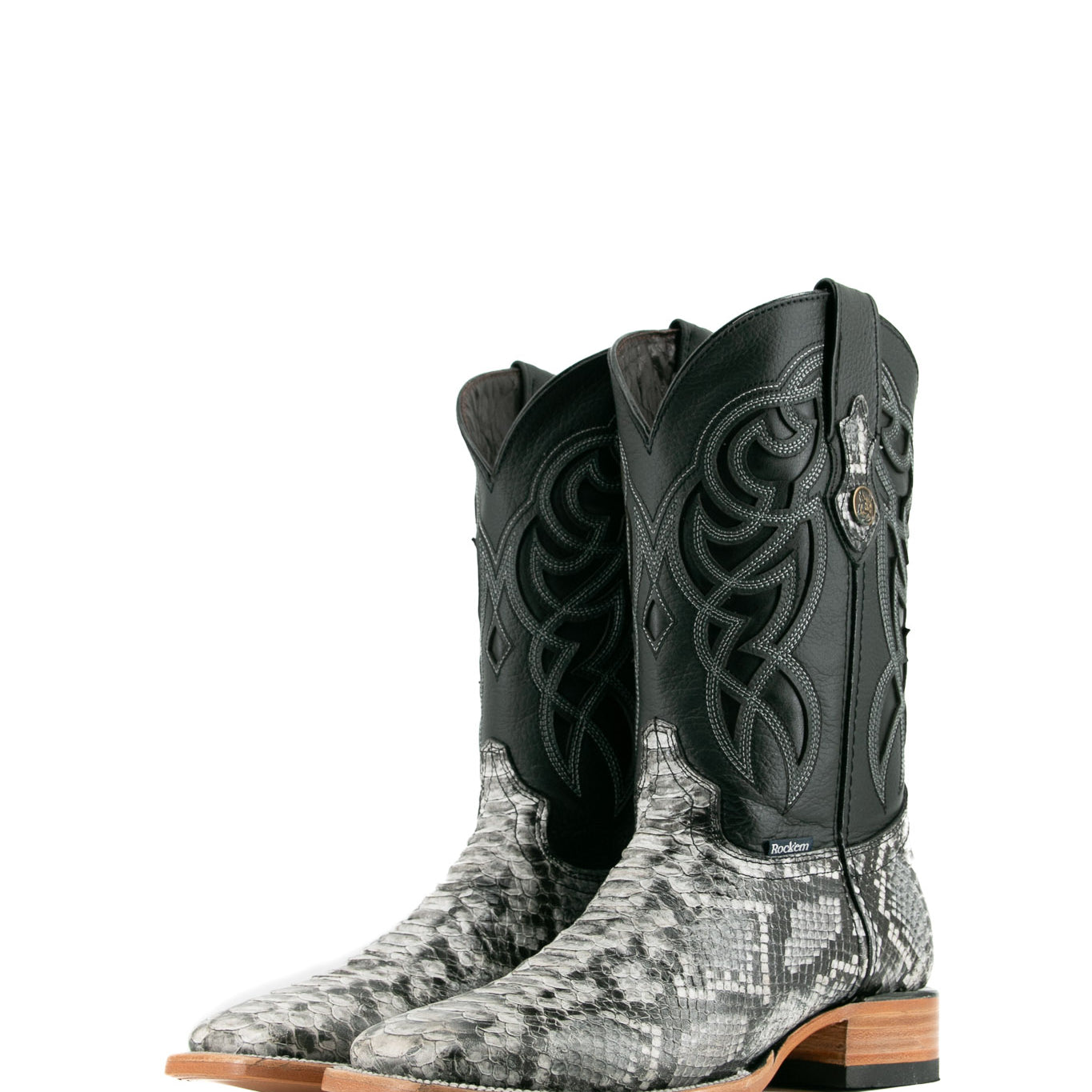 The black Python cowboy boots are crafted from genuine leather, featuring a square toe, python print vamp, a black embroidered shaft, and a rubber heel.