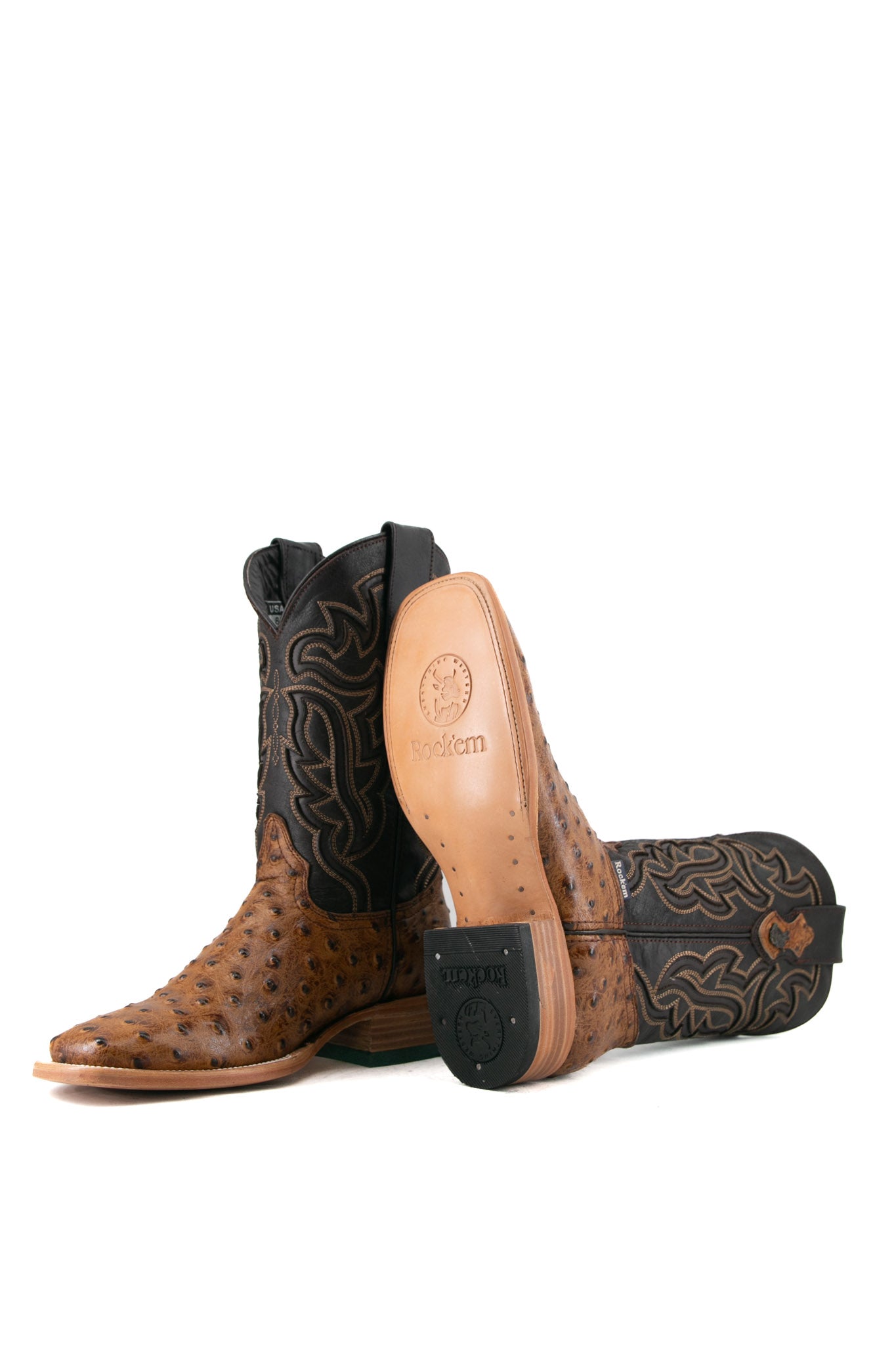 Side view of the Bruce ostrich cowboy boot in maple showcasing the leather sole and rubber heel. 