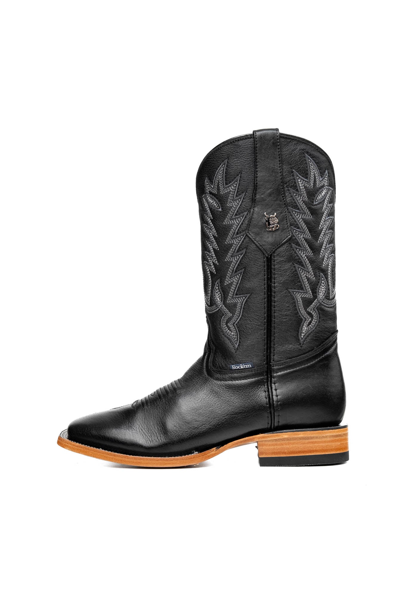 The Heritage Rainbow cowboy boots feature black leather with intricate stitching and embroidery, a Rock'em bull emblem, durable leather sole, and rubber heel.