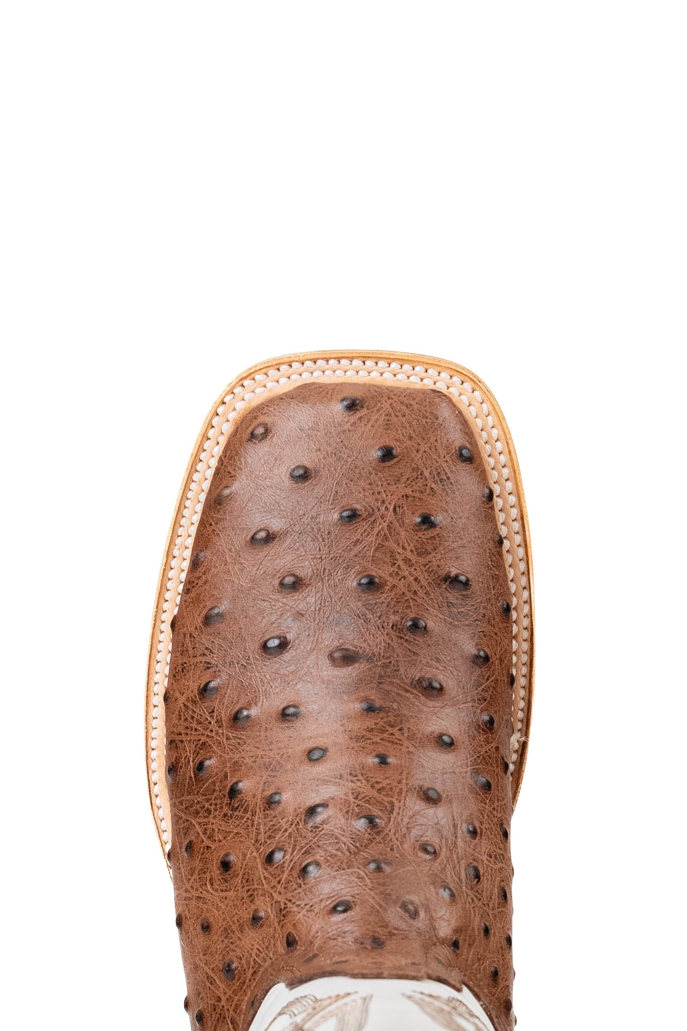 The Renegate Ostrich boots have a bumpy brown vamp, white shaft with embroidery pattern, a square toe, and a sturdy leather sole with a rubber heel.