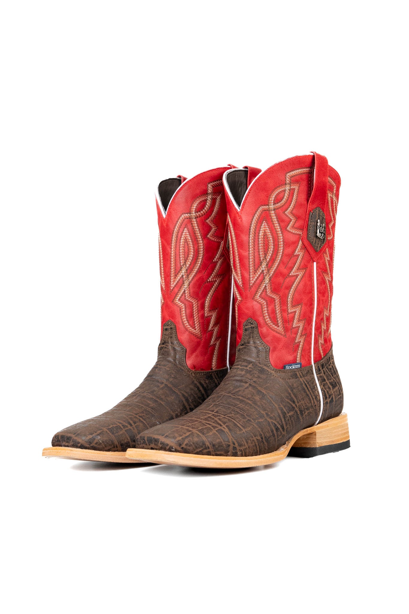 The Renegate Elephant cowboy boots are crafted from genuine leather, featuring a square toe, brown elephant print vamp, red shaft with embroidered shaft, and rubber heel.