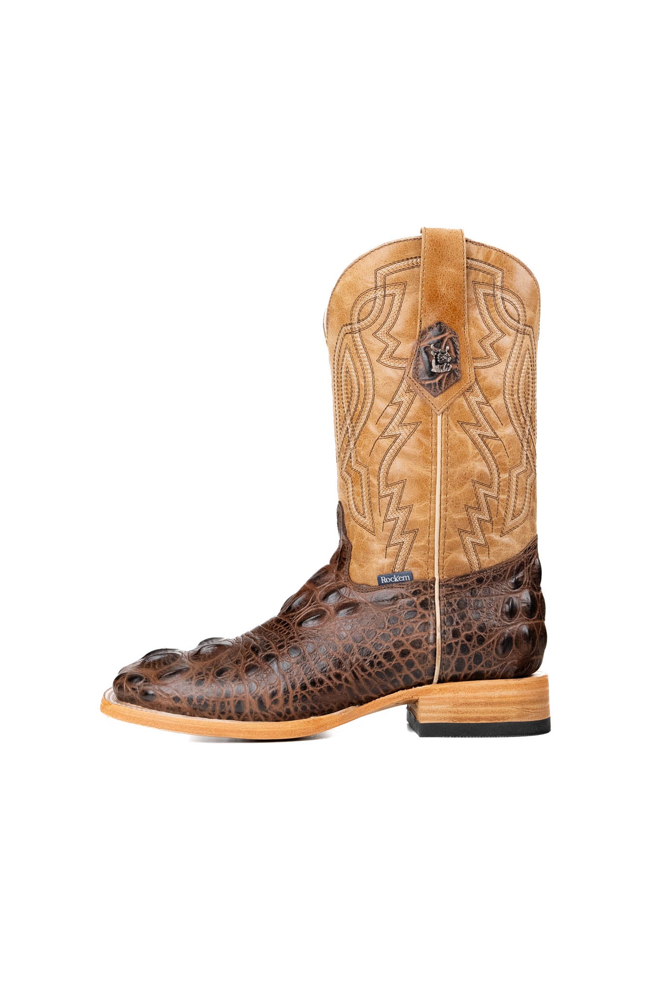 Side of the Renegate Giant Alligator Cowboy Boot in brown made of genuine leather, featuring a square toe, brown caiman print vamp, tan shaft with embroidery, leather sole and rubber heel. 