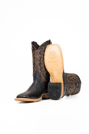 The Bruce boots feature a brown coca Python print vamp, a rugged brown leather shaft with bold inlays, a square toe, pull straps, and a sturdy Western sole.