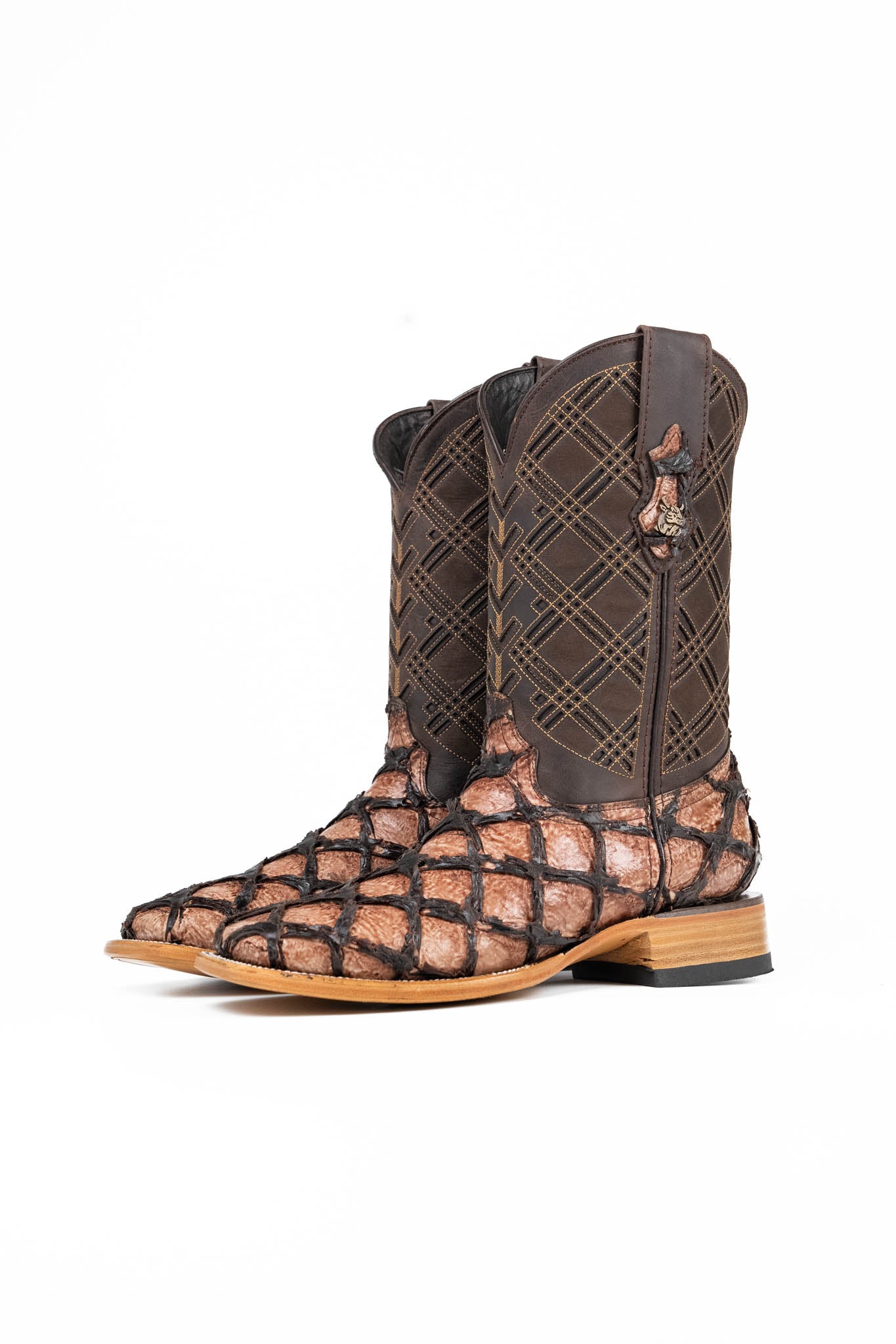 The Bradley boot features an oryx Pirarucu fish print vamp, a brown leather shaft with a laser-cut pattern, a square toe, and a natural-tone sole.