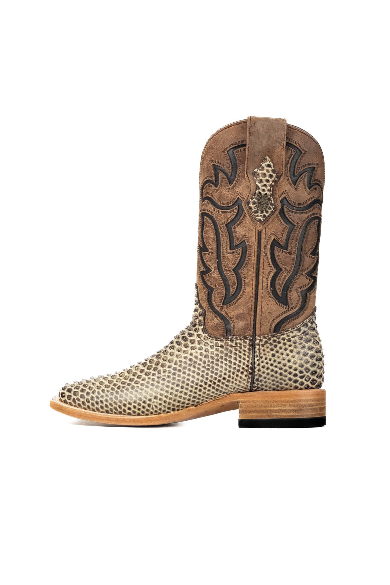 The Bruce boots have a rustic bone Python print vamp, a rugged brown leather shaft with bold inlays, a square toe, pull straps, and a sturdy Western sole.