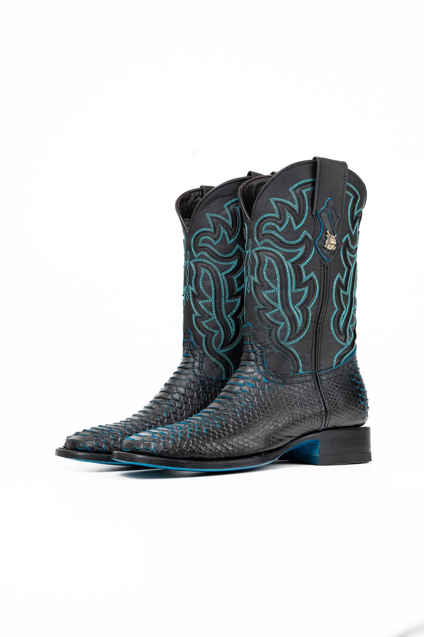 The Black Bruce cowboy boots are genuine leather, featuring a square toe, Python print vamp, turquoise embroidery shaft, rubber heel, and a turquoise sole. 