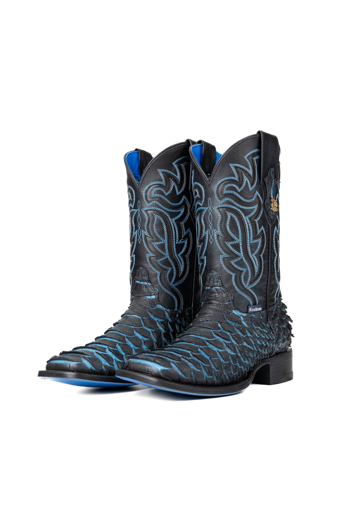 The black Bruce Jumbo Blue cowboy boots are genuine leather, featuring a square toe, python print vamp, blue embroidery shaft, rubber heel, and a blue sole. 