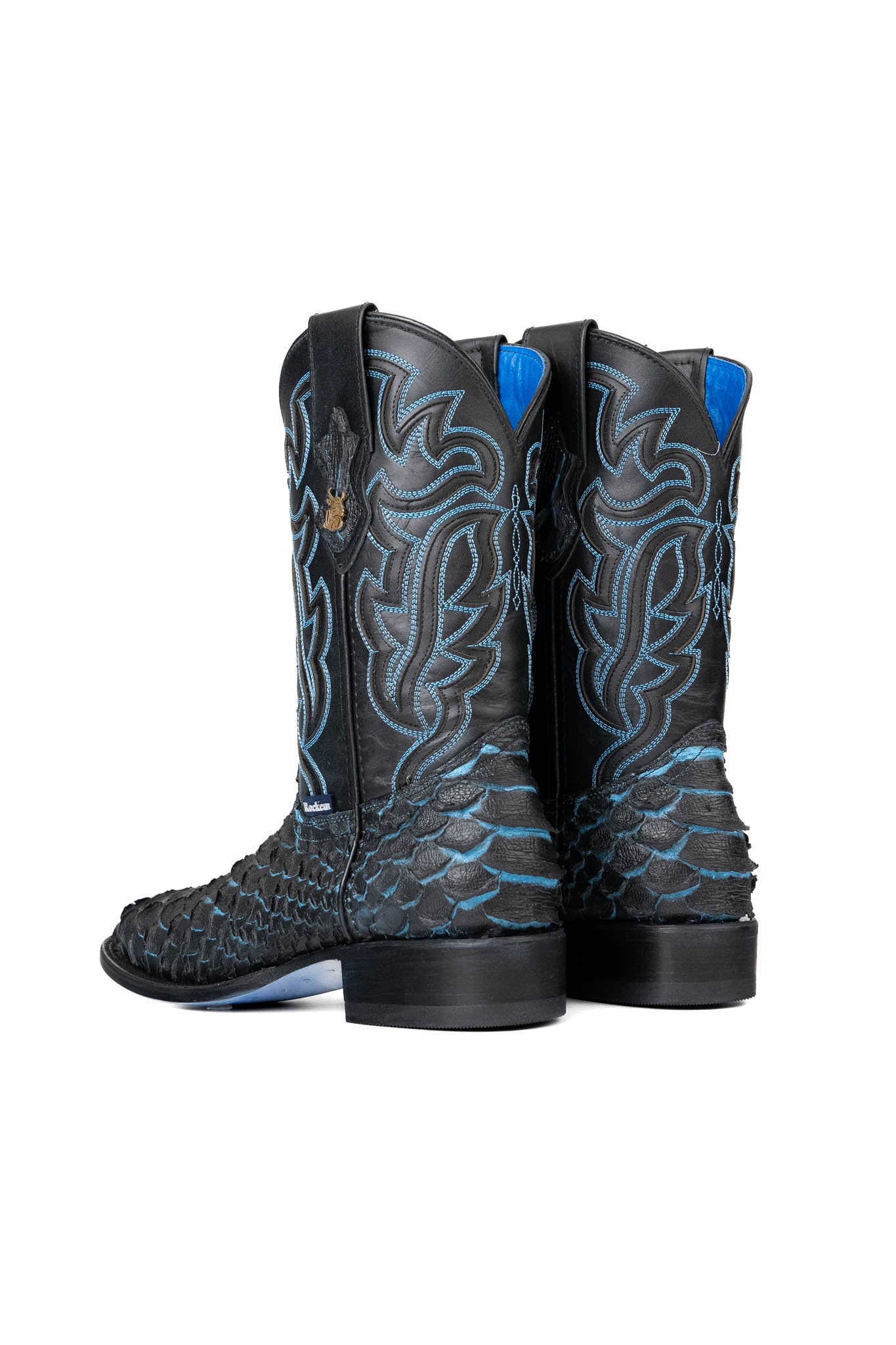 Back view of the black Bruce Jumbo Blue cowboy boots are genuine leather, featuring a square toe, python print vamp, blue embroidery shaft, rubber heel, and a blue sole. 