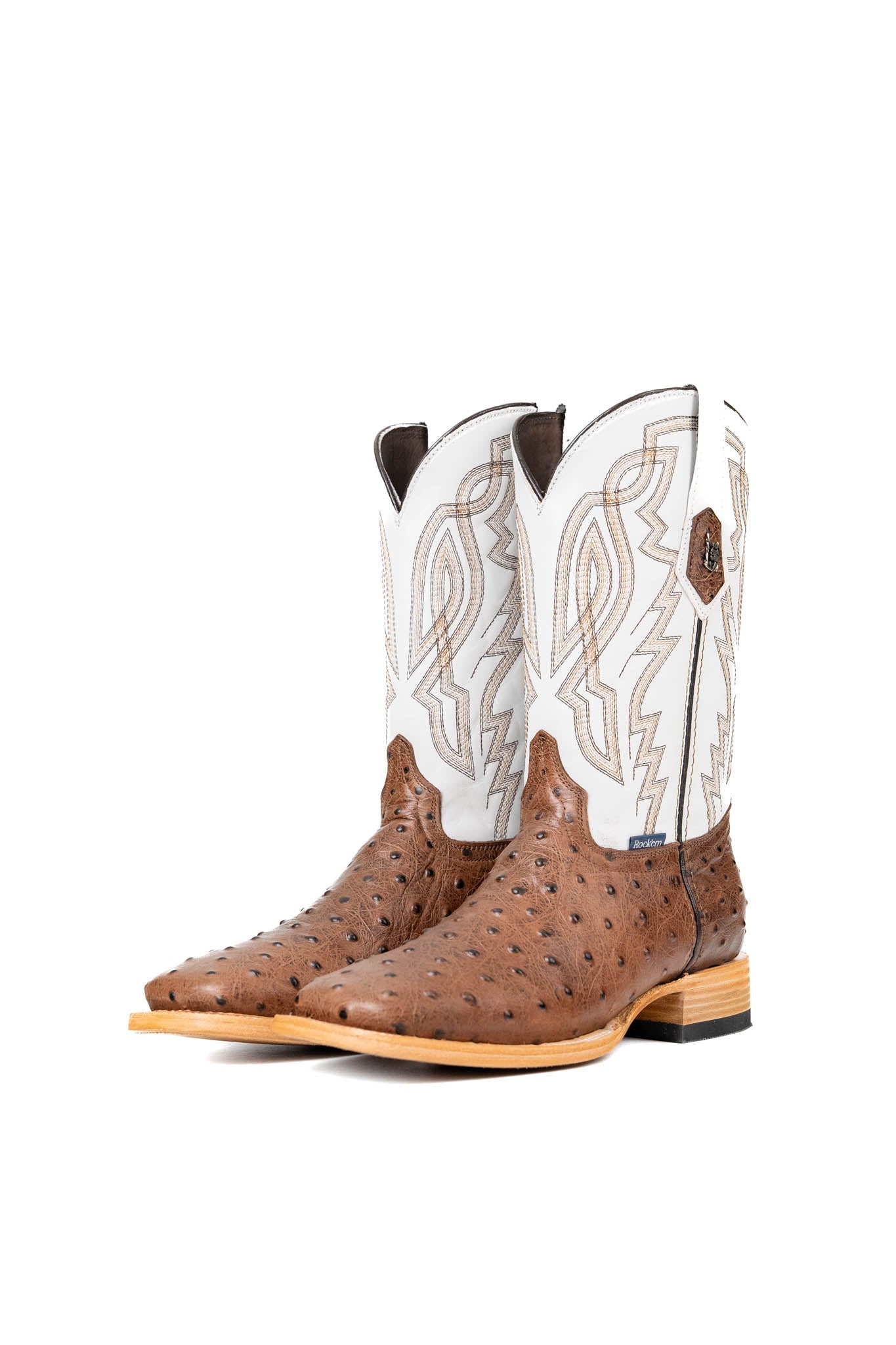 The Renegate Ostrich Square Toe has a bumpy brown ostrich vamp, white shaft with embroidery pattern, a square toe, and a sturdy leather sole with a rubber heel.