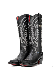 Bianca midi in black features all-black genuine leather, snip toe, detailed shaft stitching, vamp stitching and a red leather sole.