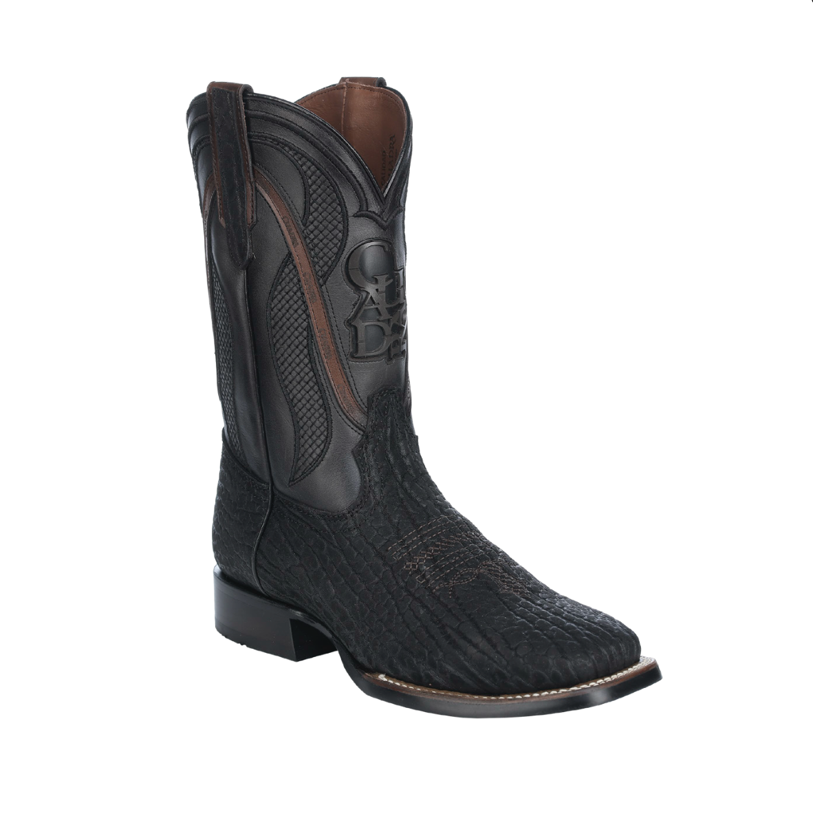 Black cowboy boot with brown accents on a white background