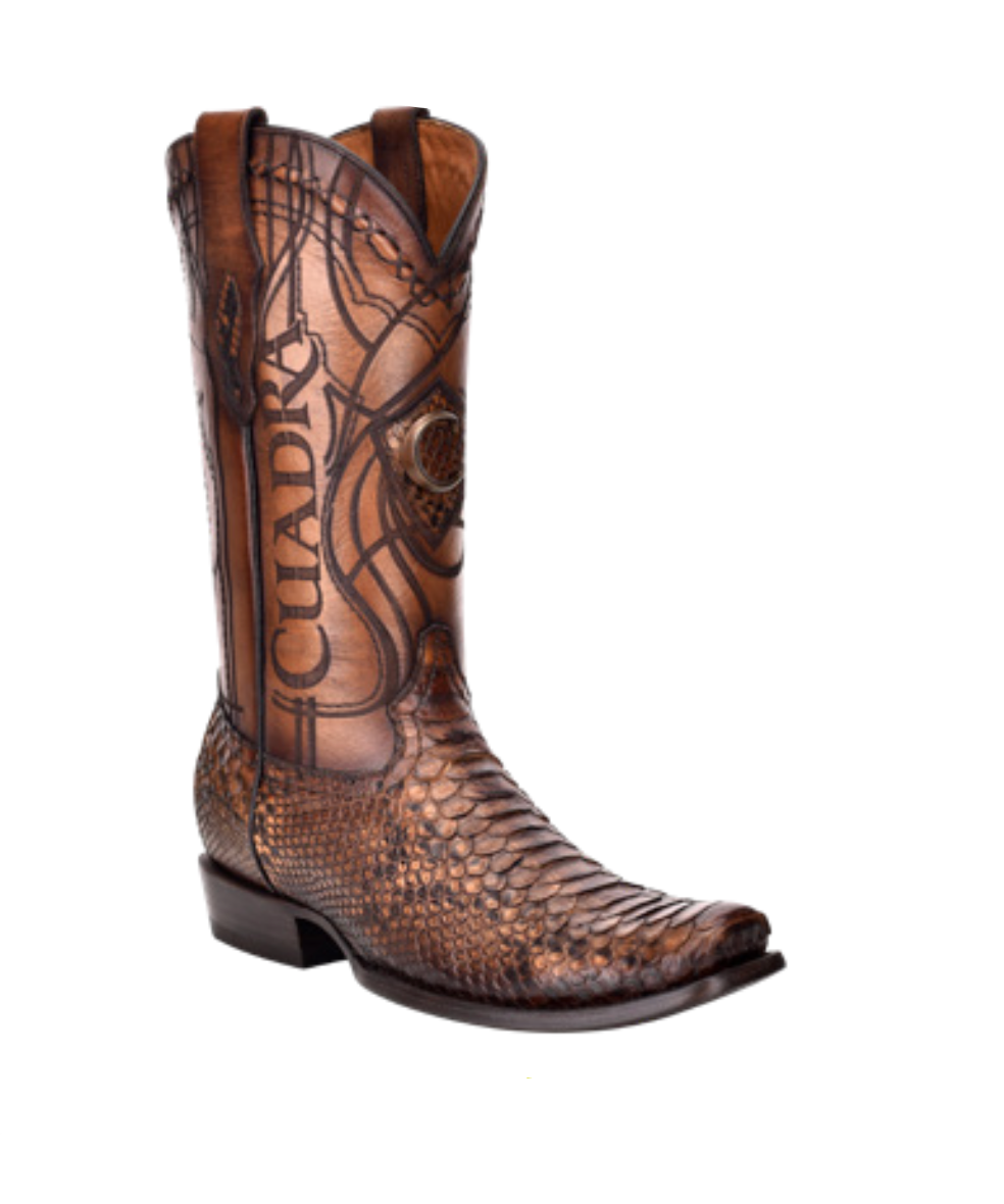 Brown cowboy boot with embossed design and matching belt on a white background
