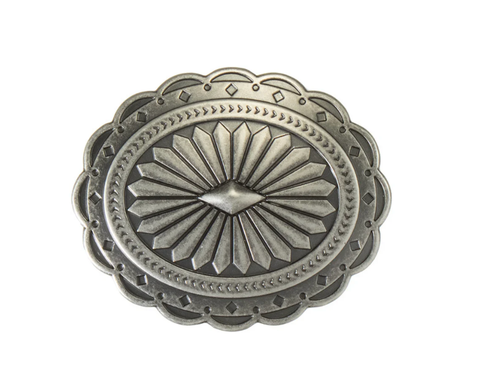 Silver decorative concho on a white background